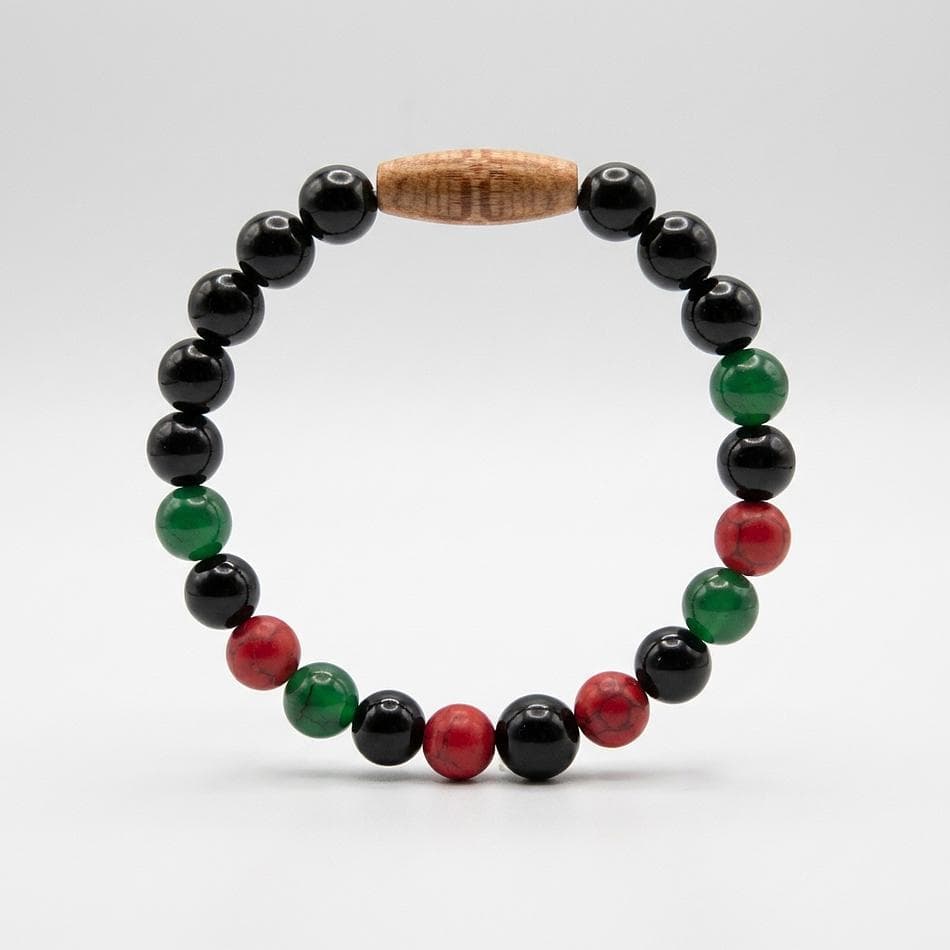 Pan-African Beaded Stretch Bracelet, Red Green Black Beads, Gold Lion Charm, Afrocentric Pride Gift, Sizes 6.5–10.5 in
